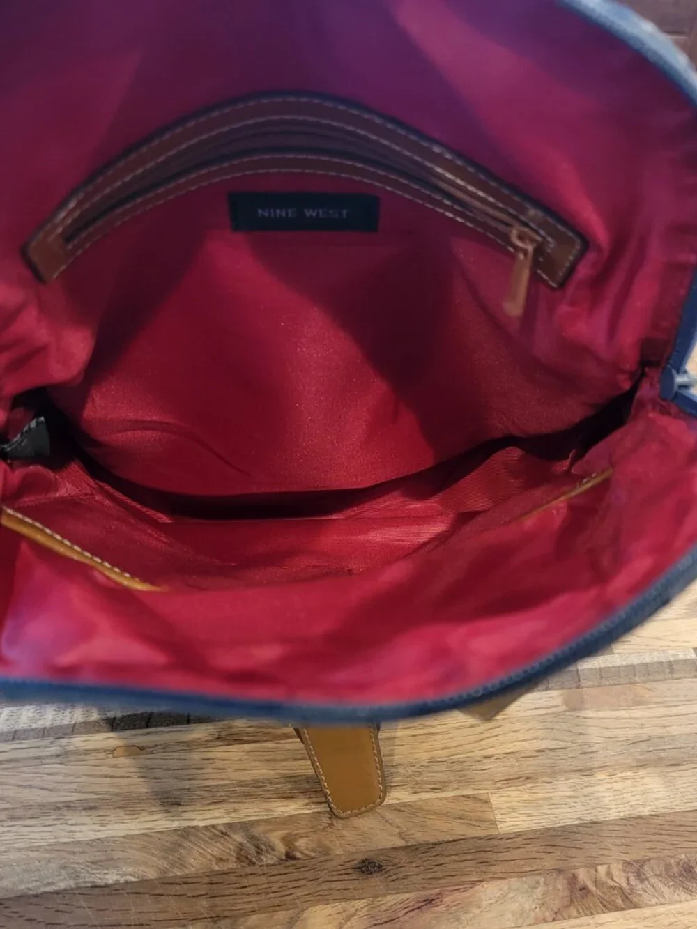 Nine West backpack purse featuring a geometric pattern and brown faux leather tr